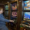 
Barb Perrone of Tucson plays a server-based slot machine at Treasure Island on Feb. 8. Regulators met 
in Las Vegas to discuss how to regulate the machines.
