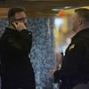 South Point security officer Dallas Reed talks to James B. Smith, who was using a cell phone in the lounge adjacent to the sports book on Friday. The Gaming Commission will soon reconsider a ban on using cell phones and other electronic devices inside sports books.