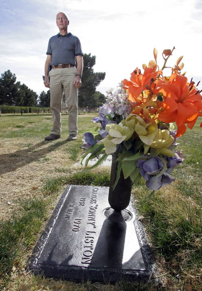 Rick Fabroski, a groundskeeper at Davis Memorial Park on Eastern Avenue, stands by Sonny Liston’s grave, Feb. 18, 2008.