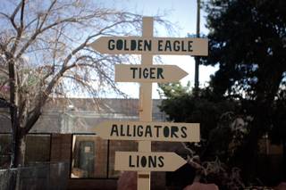 A sign points to various exhibits at the Southern Nevada Zoological-Botanical Park in Las Vegas.
