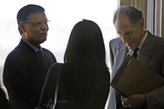 Dr. Dipak Desai, left, the majority owner of the Endoscopy Center of Southern Nevada, talks with attorney Richard Wright, right, and an unidentified woman before a hearing at Las Vegas City Hall March 3, 2008. Attorneys representing the Endoscopy Center of Southern Nevada appealed to overturn the city's suspension of the center's business license but the appeal was denied.