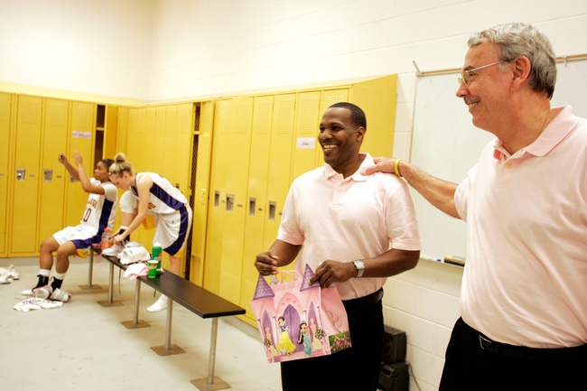 La Rocque, right, and assistant coach Al Valdez talk to their team after the game last month. La Rocque says he learned much of what he knows about coaching from legendary coach Lute Olson. 