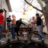 A communal dinner exemplifies the spirit of the cottages, where residents, most of whom work in entertainment, leave their front doors open during the day so their dogs can visit one another’s homes.