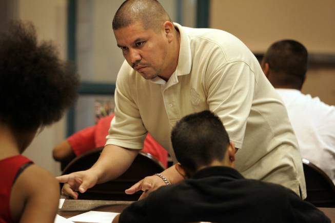 Alex Bernal, Back on Track coordinator, leads a class at the Walnut Community Center. He helps at-risk teens get high school diplomas, find jobs and avoid gangs. 
