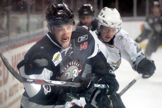 Adam Cracknell, left, of the Las Vegas Wranglers battles for the puck Saturday against Bryan Nathe of the Phoenix RoadRunners on Apr. 9, 2008 at the Orleans Arena.