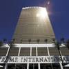 Trump's latest luxury property rises 64 stories over the Strip. A restaurant in the 1,282-suite tower is simply named DJT, his initials. Developers, real estate agents, politicians and beauty queens helped the Donald fete the opening.