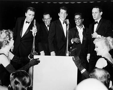 All five members of the Rat Pack, from left, Peter Lawford, Frank Sinatra, Dean Martin, Sammy Davis Jr. and Joey Bishop, perform at the Sands Hotel in Las Vegas, Jan. 20, 1960. Their gigs were often improvised and when one member of the Rat Pack was scheduled to give a performance, other members would show up for an impromptu show.