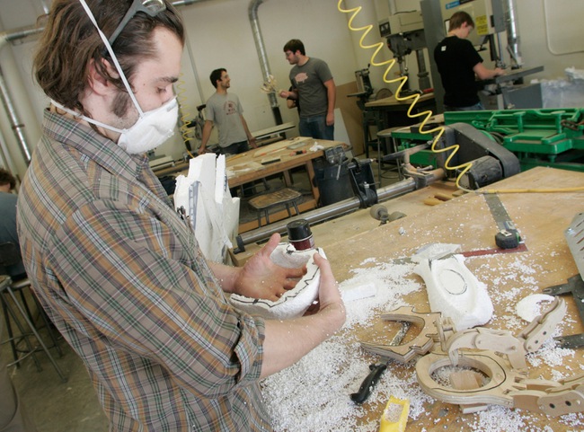 Jesse Smigel works with Styrofoam as he builds a claw for the class. Local entertainment industry leaders say graduates with this experience are in high demand. 