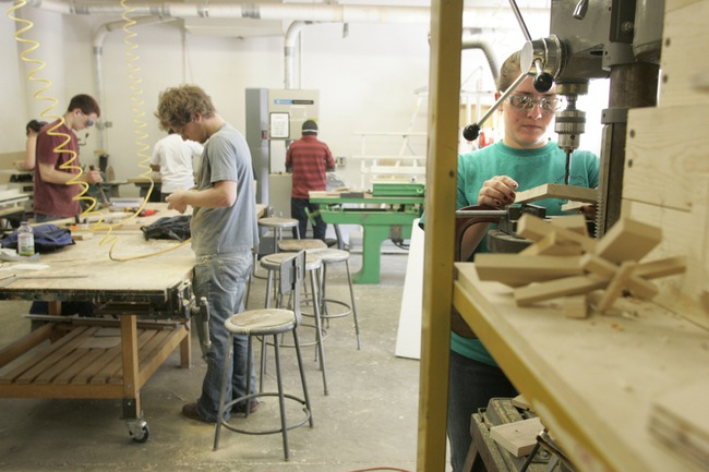 Jillian Rasmussen sets up a drill press in the workshop. The goal of the bachelor's degree program is to equip a generation of engineers to design and build the theatrics increasingly demanded by the entertainment industry. 