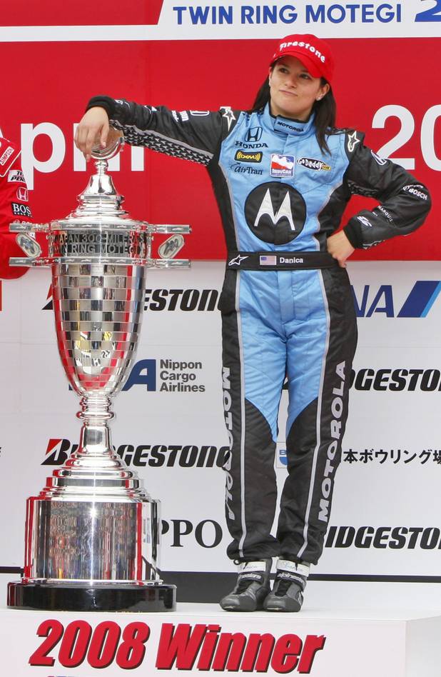 Danica Patrick of Andretti Green Racing poses on the podium ...