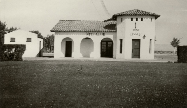 The Pair O' Dice Nite Club, sits aside Highway 91 in this 1930s photo. The Pair O' Dice was the first nightclub on the Las Vegas Strip. Its main attraction was gambling before gambling was even legal in Nevada. The property was bought and turned into the 91 Club in 1939, which itself was rebuilt as the Last Frontier in 1942. 