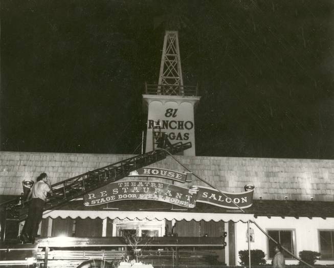 Firefighters struggle to contain a blaze that threatens the iconic windmill of the El Rancho Vegas Hotel, but efforts were in vain, as fire soon spreads to the windmill. The hotel is the first official hotel casino to open on The Strip, but it's now an empty lot.