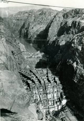 Boulder Dam's framework shown from the downstream side as its construction gets underway. The Hoover Dam project is awarded to Six Companies Inc. The chief executive of the company develops many of the techniques used to build the dam. Due to the furious pace the workers were subjected to, the project is finished two years ahead of schedule in 1935.