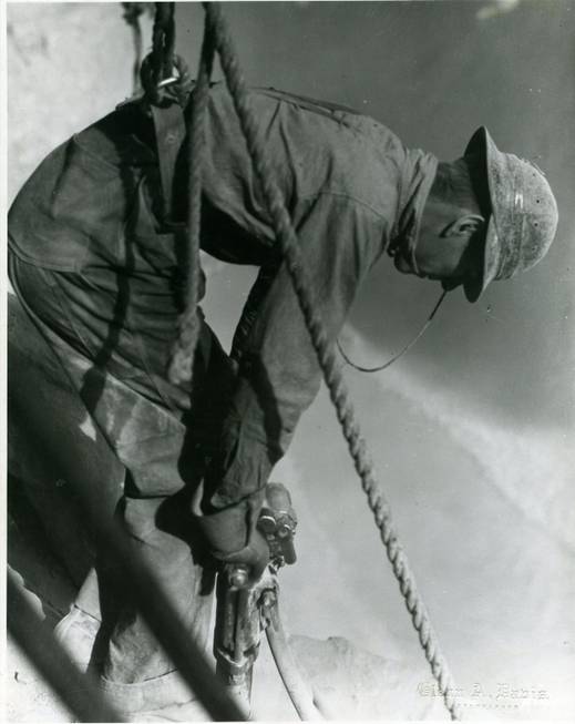 An unidentified worker applies a jackhammer to rock in Boulder ...