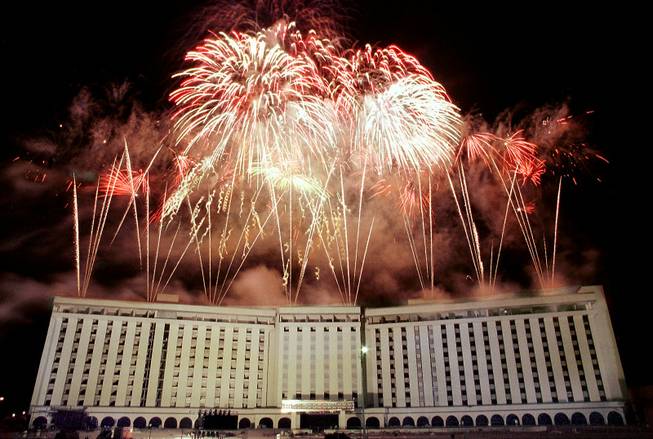 Fireworks erupt from the roof of the Hacienda hotel-casino minutes before it is imploded on New Year's Eve Dec. 31, 1996. 