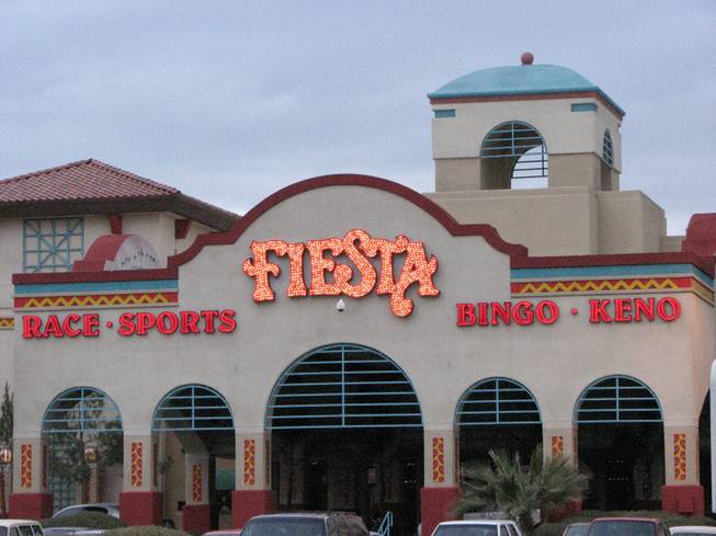 The sign of the Fiesta Rancho lights up as dusk falls over the hotel-casino. The Fiesta Rancho was the first ever Fiesta casino. It was owned and operated by the Maloof family until Station Casinos Inc. bought the property in January 2001 and franchised the Fiesta name. 