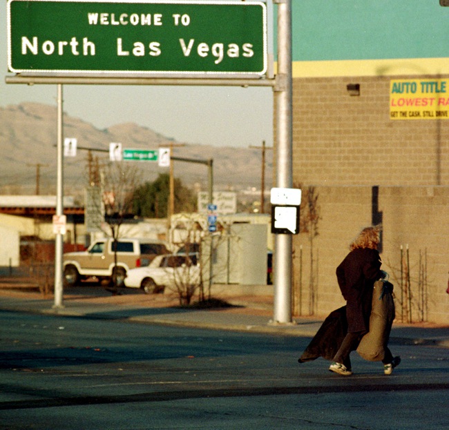 A homeless man crosses Las Vegas Boulevard into North Las Vegas on Feb. 15, 1999, showing that it's not all glitz and glamour in “Sin City.”