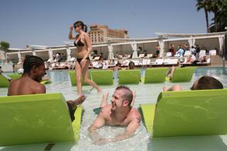 UNLV students Sean Baker, 22, left, and Blake Koll, 23, lounge in the pool during the pool party at MGM Grand's new Wet Republic thrown by the UNLV Nightclub Management class as their semester-end project.