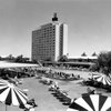 The Sahara's 14-story tower rises out of the desert as guests lounge around the pool in this 1960s photo. Real estate developer Del Webb bought the property from Milton Prell in 1961 and orchestrated a $100 million merger between his construction company and the California-Sahara Corp., creating the first publicly traded company to own casinos.