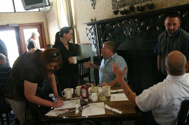 Members of the CityShare Network including Tori Patrick, center left, and Steve Davis say networking and referrals are even more important in tough economic times. The group meets every Thursday for breakfast at Fireside Restaurant and Tavern.