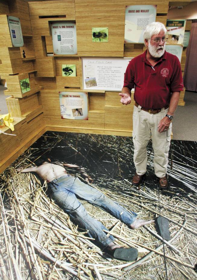 Lee Goff says the exhibit's two molded replicas of corpses show the bodies' color in various stages of decomposition. Bugs can get busy on a corpse within 10 minutes of death.
