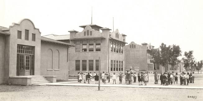 When children played outside its doors, the Fifth Street School was known as the Las Vegas Grammar School, the center building in this photo. 