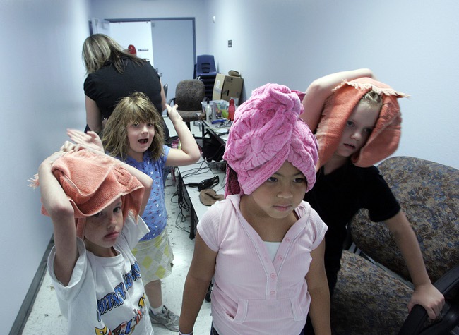 Students wait for their free haircuts at Whitney Elementary School. Many of the East Las Vegas school's students live in low-income housing or in weekly motels -- if they have homes at all.