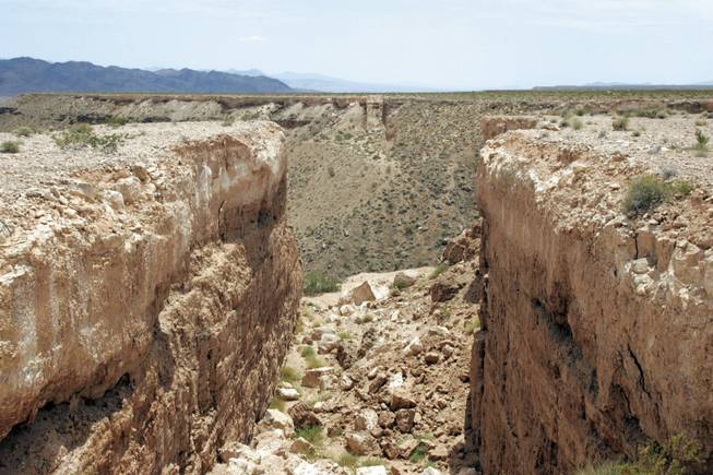 This is the view looking south at "Double Negative," Michael Heizer's first prominent earthwork. "Double Negative" consists of two trenches cut into the eastern edge of the Mormon Mesa northwest of Overton. Many residents don't know it's there, and the Moapa Valley Chamber of Commerce does not mention its existence on its Web site.