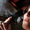 Sierra Gold bar host Tina M. Carline "smokes" a cigarette substitute that produces water vapor instead of smoke and is allowed where smoking isn't.