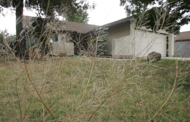 The home at 3128 Blossom Glen Drive in Henderson is abandoned and falling apart. It's in foreclosure, as are thousands in the valley. 