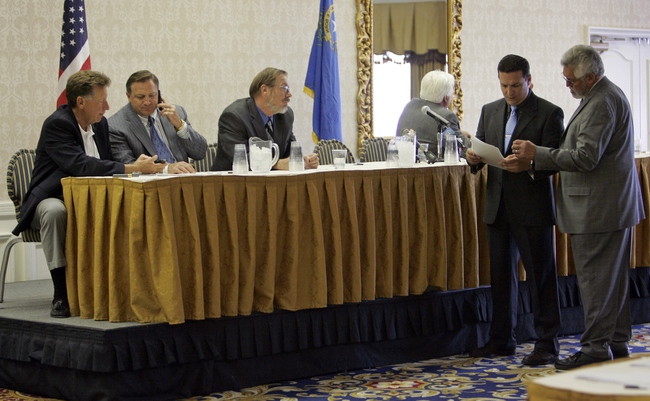 Greg McClelland, second from right, safety director for the Ironworkers' Compensation Program, confers with Joe Standley, right, president of the District Council of Iron Workers of the State of California and Vicinity, before a news conference at Bally's Monday, June 9. 