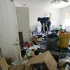 Mike Schoenbaechler cleans up a master bedroom in a foreclosed Las Vegas home last week.  With foreclosures on the rise and many people leaving their homes a mess, his cleanup business, 1-800-GOT-JUNK, is thriving.