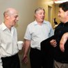 
Gaming exec Bob Kocienski, center, talks with attorneys Daniel Marks, left, and Adam Levine on Tuesday at their office.