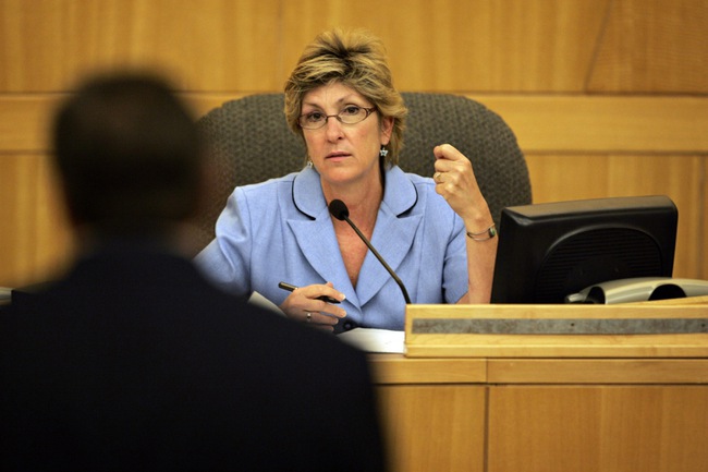 Clark County Commissioner Chris Giunchigliani listens to Steve Ross speak at Saturday's meeting. Giunchigliani called for local officials to figure out what they can do about construction workers' safety.