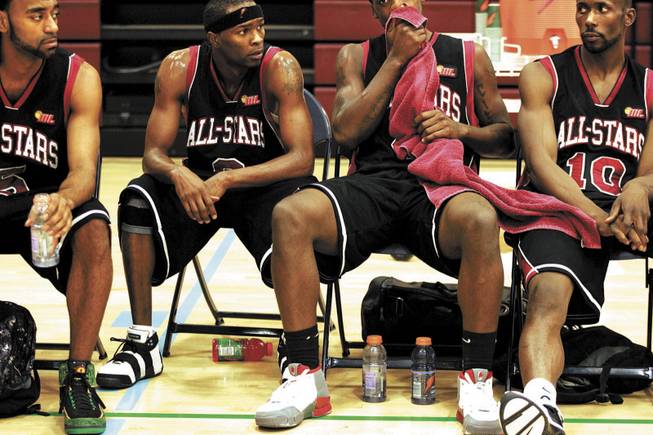 Stars players, from left, Julius Johnson, Eddie Shelby, Demario Butler and Elliott McGee rest during halftime of the Racers game. Most of the teams in the league are, like Elgin, from the region around Chicago or from the Pacific Northwest.