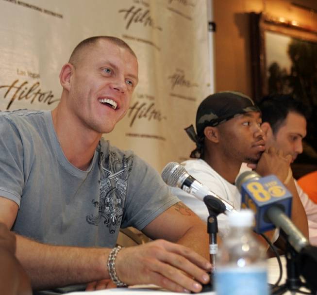 Kaspars Kambala, left, former UNLV basketball player turned boxer, speaks during a news conference at the Las Vegas Hilton Wednesday, July 2, 2008. 
