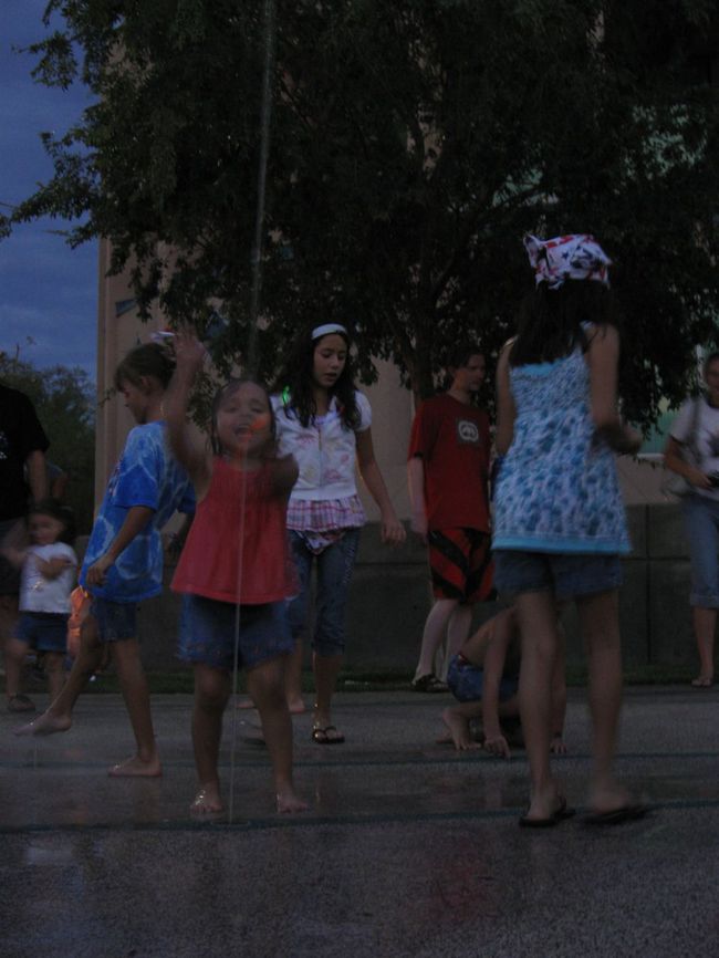 A young girl plays in the water at the Henderson Events Plaza and Convention Center before the annual Fourth of July fireworks.