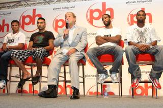 Ricardo Torres (left) and Kendall Holt (right) flank, from left, Rogelio Castaneda, promoter Bob Arum and Lamont Peterson, during a press conference Wednesday for the 