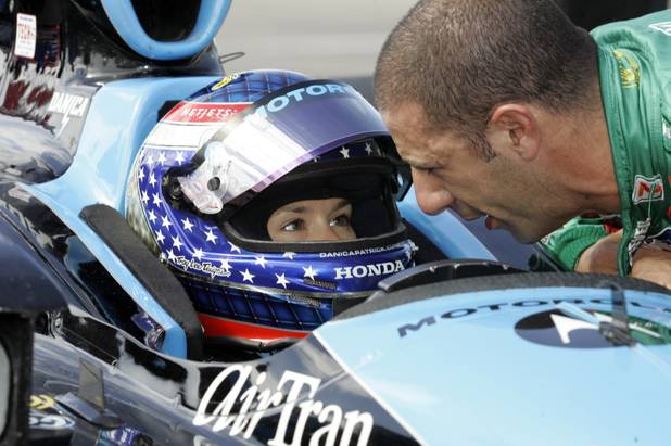 Tony Kanaan, right, of Brazil, talks with Danica Patrick during ...