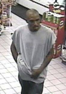 Police released two photos of a man wanted in connection with a weekend store robbery. 
