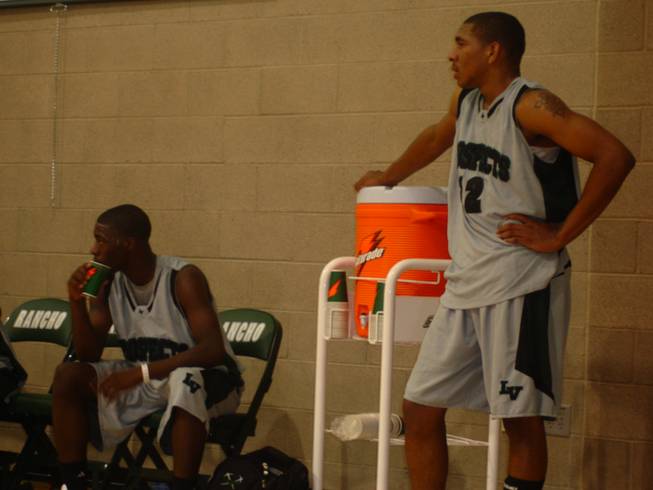 Elijah Johnson, left, and Anthony Marshall watch from the bench in the closing moments of the Las Vegas Prospects' 85-67 loss to the Compton Magic Wednesday evening at Rancho High School in pool play of the adidas Super 64. Johnson, a senior-to-be at Cheyenne, and Marshall, who will be a senior at Mojave this fall, joined forces for the first time since seventh grade this week, and have discussed the possibility of playing together at the next level. The two are both ranked by Rivals.com as top-70 recruits in the class of 2009.