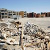 
Construction debris litters the area around unfinished midrise condominium buildings at Uptown on Centennial Parkway in North Las Vegas. Chris Adams bought his unit in 2007 while the project was still being built and before the developer let it fall into foreclosure. Adams says all work on the project has stopped. 