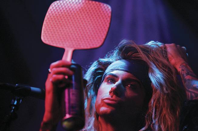 Foxxx (Travis Haley) carries a mirror with him onstage so he can check his massive hair during the show. He's also good at flipping it into place. 