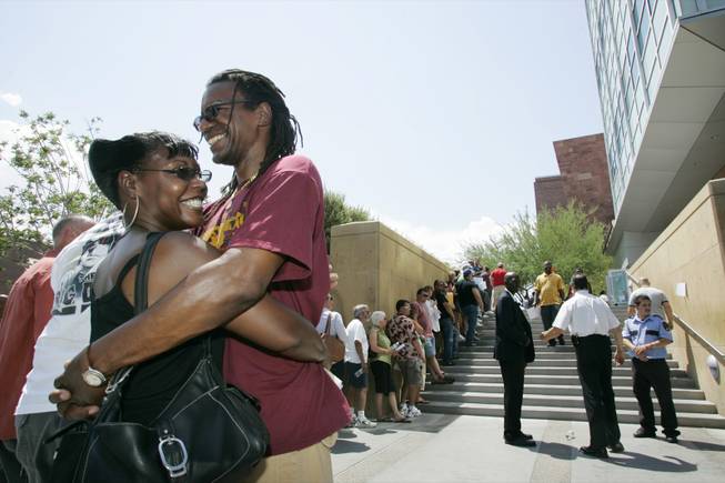 Paulette Harris and William Skinner of Tucson wait in line for a license outside the Marriage Bureau in Las Vegas on July 6, 2007.
