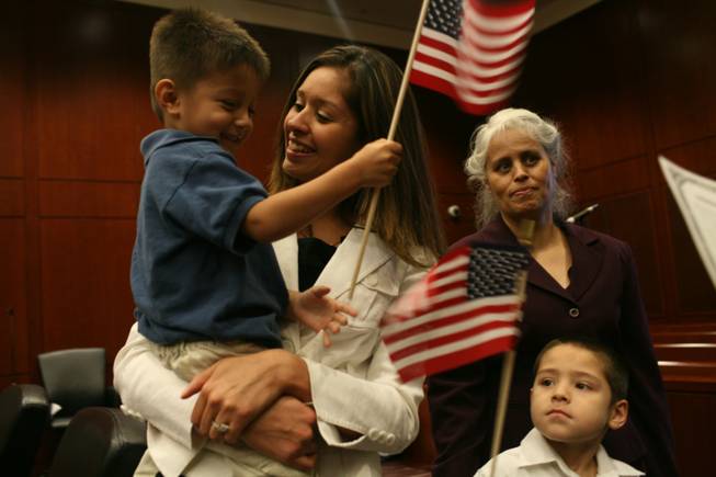 Maria Elizabeth Parra-Hernandez, 25, is a juvenile services assistant for Clark County, helping youths who have broken the law meet the terms of their probation. Her 3-year-old son, Julian, her mother, Eva Parra, and her 5-year-old brother, Angel Parra-Sandoval, joined her at her naturalization ceremony July 25 at the federal courthouse.
