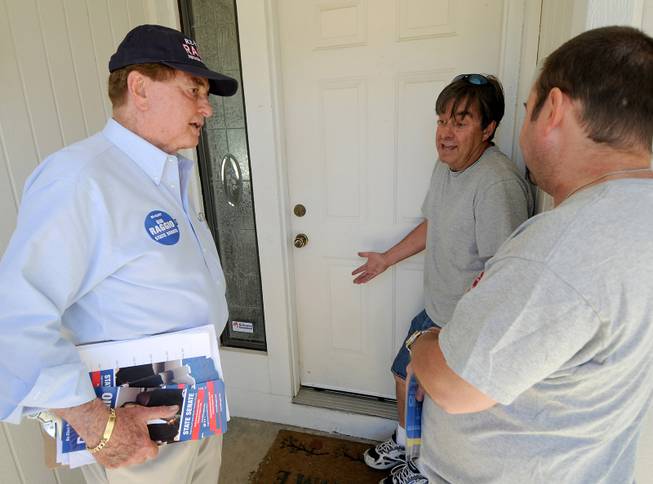 Bill Raggio tries Saturday to persuade Reno-area neighbors John Stieger and Chris Sewell to vote for him in the upcoming primary. 