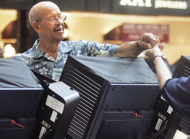 Dorsey Jones gets ready to vote during early voting for the primary election at the Galleria at Sunset on July 26.