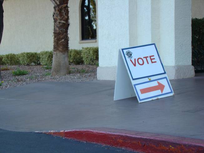A sign directs voters where to go when they arrive at Mountain Shadows Community Center's polling place inside Sun City Summerlin. Polling places are open until 7 p.m. tonight.