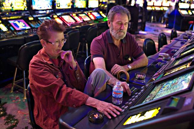 Longtime Henderson residents Lilly Santos, left, and DeVan Tippetts play the penny slots Thursday at the Rainbow. John Awalt, the casino's general manager, says, "Our restaurant gets people in the door. Service is prompt and the portions aren't skimpy.zz'