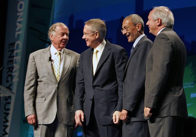 T. Boone Pickens, from left, shown with Sen. Harry Reid, D-Nev.; John Podesta, President of the Center for American Action Fund; and UNLV President David Ashley, has proposed building windmills in Texas to free natural gas now used to generate electricity for use as a motor vehicle fuel to cut consumption of foreign oil in the United States.